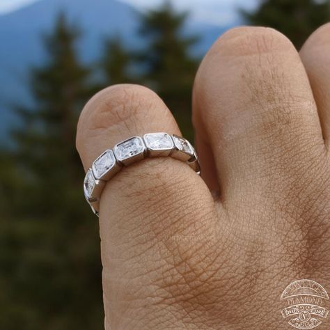 Celebrate everlasting love with our exquisite Radiant Cut Full Eternity Wedding Band and its matching East West Set Band. Crafted with a radiant cut in a bezel setting, this wedding jewelry is the perfect anniversary gift for her. Discover timeless elegance and sophistication in every detail. #RadiantCutRing #EternityWeddingBand #MatchingBand #EastWestSet #WeddingJewelry #BezelSetting #AnniversaryGiftForHer #HandcraftedJewelry #FineJewelry #BridalJewelry #LuxuryGift #CustomizableRing #Timele... Band Metal, Stone Colour, Jewellery Marketing, Metal Detail, Diamond Simulant, Ring Stone, Eternity Wedding Band, Engagement Ring Cuts, Radiant Cut