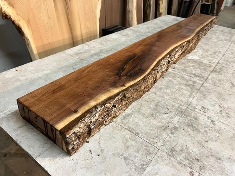 Our newly listed solid walnut live edge mantles are selling fast. This beautiful mantle measures 92 inches length x 12 inches width x 3 5/8 inches thickness. A beautiful upgrade to any home. https://www.ohiowoodlands.com/walnut-live-edge-mantle-f-241.html #ohiowoodlands #fireplacedecor #liveedgemantle #mantledecor #mantle #mantel #fireplacemantel Live Edge Wood Mantle Fireplace, Live Edge Mantel Ideas, Fireplace Wood Mantle, Live Edge Mantle, Cedar Mantle, Walnut Mantle, Wood Mantle Fireplace, Walnut Live Edge, Wood Mantle