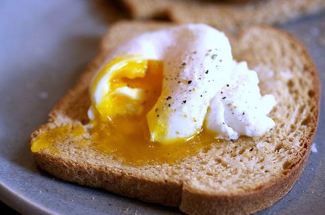 How to cook a perfect poached egg: Bring water to a boil. Drop egg (in shell) in. Boil for 5 to 6 minutes. (I did 5 1/2.) Peels like a dream. Solid white, runny yolk. Heaven on toast. Poached Eggs On Toast, Meals Under 400 Calories, Poach An Egg, Eggs On Toast, How To Make A Poached Egg, Perfect Poached Eggs, Smitten Kitchen, Poached Egg, Egg Dish