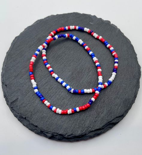 Introducing the Fourth of July Red, White, and Blue Stack of Two Handmade Beaded Bracelets! A perfect gift for you, your loved ones or friends this July 4th!  Made with high-quality materials, this beaded bracelet is not only stylish but also durable, ensuring it will last for years to come. It is the perfect accessory for any outfit. Whether you wear it alone or stack it with other bracelets, this is bound to become the most fun piece in your jewelry collection. Each bracelet is handmade using 4th Of July Bracelets, Beaded Bracelet Stack, July Fourth, Unique Jewelry Gifts, Diy Bracelet Designs, The Fourth Of July, 4th Of July Outfits, Bracelets Handmade Beaded, Themed Jewelry