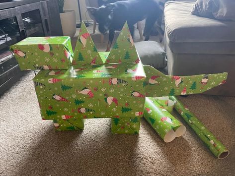 Dinosaur Wrapping Ideas, How To Wrap A Skateboard Present, Dinosaur Present Ideas, Dinosaur Gift Wrapping Ideas, Funny Ways To Wrap Christmas Gifts, Ways To Wrap Christmas Gifts, Jurassic Park Christmas, Funny Christmas Wrapping, Wrap Christmas Gifts