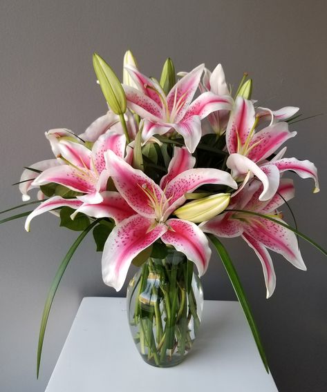 This sweet bouquet is an expression of your love and affection. Fragrant pink stargazer lilies are arranged in a clear glass vase for your loved one! Your choice of three sizes - medium, large (as shown), or premium.  SKUs: ,SIMPP,SIMPL,SIMPM Lilies Flowers Bouquet, Lilies In A Vase, Lily In Vase, Pink Lily Bouquet, Lilies In Vase, Lillies Bouquet, Stargazer Lily Arrangement, Lilys In A Vase, Lily Arrangement Vase Floral Design