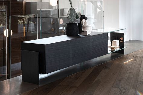 The Fly sideboard by Cierre is a prime example of a sophisticated storage solution perfect for a modern home. The sleek silhouette features a combination of closed compartments in wood, and an open shelf finished in glass. Thanks to the contrasting materials, it creates a vibrant juxtaposition for an eye-catching touch. The closed compartments have swing doors and are ideal for storing belongings, while the shelf and spacious top allow you to display pieces of decor. Manufactured in Sophisticated Storage, Italian Leather Sofa, Sofa Manufacturers, Console Storage, Geometric Inspiration, Furniture Details, Open Shelf, Leather Furniture, Wood Storage