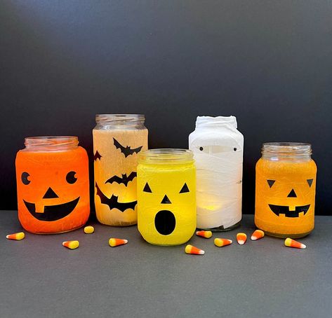 Easy, Spooky Recycled Jar Halloween Lanterns — super make it Recycle Material, Crepe Paper Streamers, Yarn Hanging, Battery Operated Tea Lights, Black Construction Paper, Paper Streamers, Halloween Lanterns, Extra Yarn, Jar Lanterns