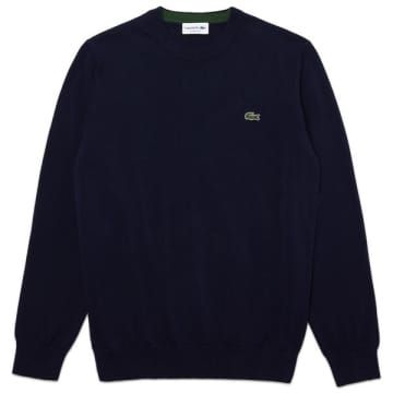 Classic fitting crew neck knitted sweat from Lacoste crafted from eco-responsible organic cotton. Featuring contrasting details and ribbed finished. Finished with signature embroidered crocodile branding on chest. Fit: Regular Material: 100% Cotton Product ID: AH1985 00 166 Synonymous for creating the revolutionary first ever cotton Polo shirt, the Lacoste brand remains globally recognised for their iconic crocodile embroidered logo, and are renowned for their design innovation and signature Fre Lacoste Clothing, Randolph Sunglasses, Green Crocodile, Red Wing Shoes, Polo Sweatshirt, Timeless Wardrobe Staples, T-shirt Polos, Cotton Style, Sweatshirt Shirt