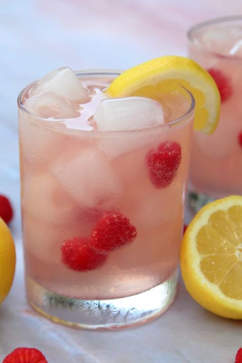 Raspberry Lemonade Vodka Spritzer | System of a Brown Raspberry Lemonade Vodka, Limoncello Cocktails, Coctails Recipes, Raspberry Vodka, Vodka Lemonade, Lemonade Cocktail, Refreshing Summer Cocktails, Spring Cocktails, Raspberry Syrup