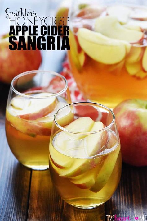 Sparkling Apple Cider Sangria ~ a festive fall cocktail recipe with just three ingredients -- white wine, apple cider, and sweet sliced Honeycrisps -- perfect for tailgating, Halloween, Thanksgiving, and even Christmas! | FiveHeartHome.com Sparkling Apple Cider Sangria, Autumn Sangria, Apple Sangria Recipes, Apple Cider Sangria Recipe, Fall Sangria Recipes, Moscato Sangria, Caramel Apple Sangria, White Wine Sangria Recipe, Sparkling Apple Cider