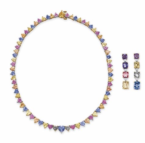 A SET OF MULTI-COLORED SAPPHIRE JEWELRY, BY BVLGARI. Comprising a necklace, designed as a graduated line of heart-shaped multi-colored sapphires; and a pair of ear pendants, designed as a graduated line of cushion-cut multi-colored sapphires and half moon diamonds, mounted in platinum and gold, 15¾ ins., in a BVLGARI black leather case. Each signed BVLGARI, necklace no. 528. (2) Mens Bracelet Gold Jewelry, Colored Sapphires, Jewelry Rendering, Bvlgari Jewelry, Proposal Box, Semi Precious Gems, Mens Gold Bracelets, Lovely Necklace, Sapphire Jewelry