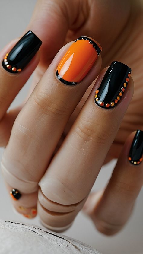 Get inspired for Halloween with these spooky and cute nail art designs From simple to trendy black to red these easy and short Halloween nail ideas are perfect for adding a hint of spookiness to your look Check out these stylish and subtle Halloween nail designs now Short Black And Orange Nails, Black And Orange Nails, Nails Music, Halloween Nail Ideas, Graduation Nails, Cute Nail Art Designs, Nails Halloween, Designs Nail, Halloween Nail Designs