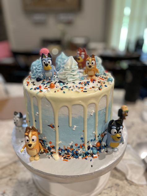 This Bluey birthday cake is 8” - 3 layer with white chocolate drip and plenty of Bluey sprinkles! It was fun to make! Bluey Birthday Cake 4, Number 2 Bluey Birthday Cake, Red White And Bluey Birthday, Bluey Party Desserts, Chocolate Bluey Cake, Bluey 3rd Birthday Cake, Bluey Cake Ideas 2nd Birthday, Boy Bluey Birthday Party, Four Real Life Bluey Birthday