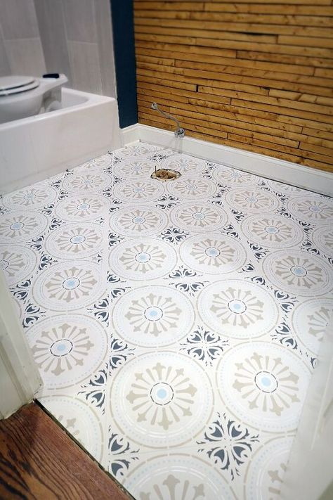 I know, who needs another lesson on how to stencil paint a ceramic tile floor? This one is different though. It’s cheaper, it’s easier. And you get great results. Check it out! Our hall bathroom floor is a disaster. I have never seen such a poor tiling job in my life. Everything was wrong with it, on top of the color(s) just not working for me.Rather than rip it out I opted to stencil paint it. There are a few steps to this and a lot to be aware of so be sure to swing by my blog an… Antique Backsplash, Painting Ceramic Tile Floor, Ceramic Tile Floor, Farmhouse Clock, Paint Tile, Stencil Paint, Vinyl Sheet Flooring, Painted Concrete, Diy Stencil