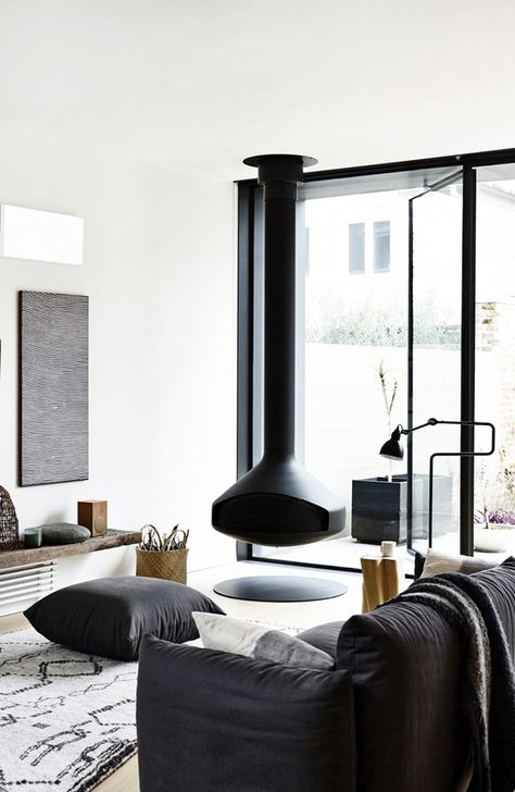 I love the stylish decor of this Victorian terrance house in Melbourne, Australia. My eyes are immediately drawn to the beautiful art pieces, collected by owners Annick Houle and Stephen O’Connor (who Hovering Fireplace, Hanging Chimney, Interesting Fireplace, Floating Sculpture, Suspended Fireplace, Hanging Fireplace, Floating Fireplace, Black Living, Victorian Terrace House