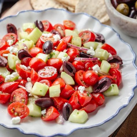 Mediterranean Cucumber Salad with tomatoes, red onion, kalamata olives, and feta cheese. Mediterranean Cucumber, Mediterranean Cucumber Salad, Tomato Cucumber Salad, Tomato And Onion Salad, Potluck Salad, Salad Tomato, Mediterranean Foods, Keto Salads, Low Carb Menus