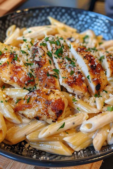 This Creamy Parmesan Chicken with Penne is the perfect weeknight dinner! Tender chicken, penne pasta, and a rich Parmesan cream sauce come together in just 30 minutes for a delicious meal that everyone will love. Easy to make, family-friendly, and packed with flavor, it's a dish you'll want to make again and again. Save this pin and try it for dinner tonight! Creamy Chicken Pasta Healthy, Chicken Parm And Pasta, Pasta Dishes Recipes Chicken, Chicken Tenderloin Recipes With Pasta, Noodles And Company Parmesan Chicken, Creamy Parmesan Chicken With Penne, Dinner Ideas For Two Pasta, Pasta And Chicken Recipes Easy, Best Chicken Pasta Recipe