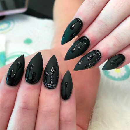 Black Nail Designs: Almond Drip. Matte black nails paired with a shiny drip design. Click through for 30 black nail design ideas. #blacknailpolish #blacknaildesigns #nailideas IG: @nessasnails9 Almond Nails Black And White, Black Nail Designs Almond, Vanessa Cooper, Blood Nails, Black Almond Nails, Witchy Nails, Matte Black Nails, Star Nail Art, Indigo Nails