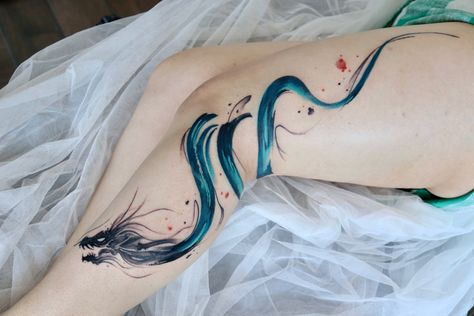 Watercolor dragon tattoos Watercolor Dragon Tattoo, Dragon Meaning, Dragon Tattoos, Water Dragon, Crystal Dragon, Arm Sleeve Tattoos, Paint Strokes, Rainbow Crystal, Dragon Tattoo