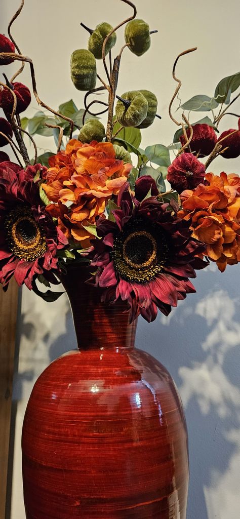 Burgundy sunflower, orange hydrangeas and green and Burgundy velvet pumpkin picks as fall decor arrangement Burnt Orange And Sage Green Home Decor, Orange And Maroon Living Room Decor, Burgundy Fall Decor, Burgundy Fall Decor Home, Orange And Purple Fall Decor, African Decor Living Room, Burnt Orange Decor, Orange Fall Decor, Burgundy Decor