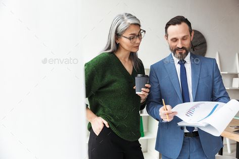 Photo of colleagues drinking coffee while working with documents by vadymvdrobot. Photo of adult concentrated colleagues talking and drinking coffee while working with documents in office #Sponsored #coffee, #working, #drinking, #Photo Environmental Consultant, Couple Business, Business Couple, Mechanical Workshop, Architectural Model, Lease Agreement, Service Learning, Melbourne Victoria, Resource Library