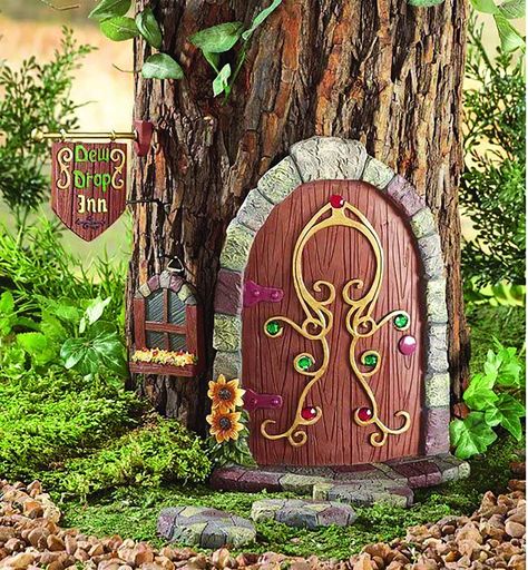 PRICES MAY VARY. Decorative door fits around a tree trunk. Six-piece set includes a decorative door, a window, a sign and 3 pathway stones. Door, window and sign all have hardware on the back for hanging. Hand-painted resin. Door measures 6 1/2"L x 1 3/4"W x 8 1/2"H. Gnome Tree, Fairy Gnome, Fairy Garden Doors, Gnome Door, Tree Statues, Garden Door, Outdoor Trees, Faeries Gardens, Stone Pathway