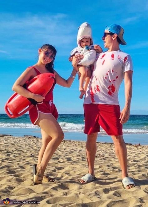 Deva: Our Family costume theme is “Baby Shark Attack!” Located at Red Frog Beach, Bastimentos Island, Panamá. Our son represents the baby shark, my husband as the victim, and myself as... Life Guard And Shark Halloween Costume, Shark And Victim Costume, Baby Shark Family Costume, Shark Lifeguard Family Costume, Bastimentos Island, Dog In Shark Costume, Shark Halloween Costume, Shark Baby Costume, Life Guard