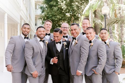 groomsmen Black Tux Groom, Dark Grey Groomsmen, Cruiseport Gloucester, Bridal Party Color Schemes, Groom Suit Black, Gray Groomsmen Suits, San Diego Beach Wedding, Beach Wedding Groom, Groom Suit Grey