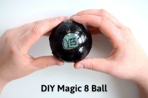 Hands holding a homemade magic eight ball showing the answer of "yes" with the text "DIY Magic 8 ball" written on it Crystal Balls Diy, How To Make A Magic 8 Ball, Diy Magic 8 Ball, Best Fabric Paint, Wicked Crafts, Black Fabric Paint, Plastic Bottle Caps, Magic 8 Ball, Ball Drawing