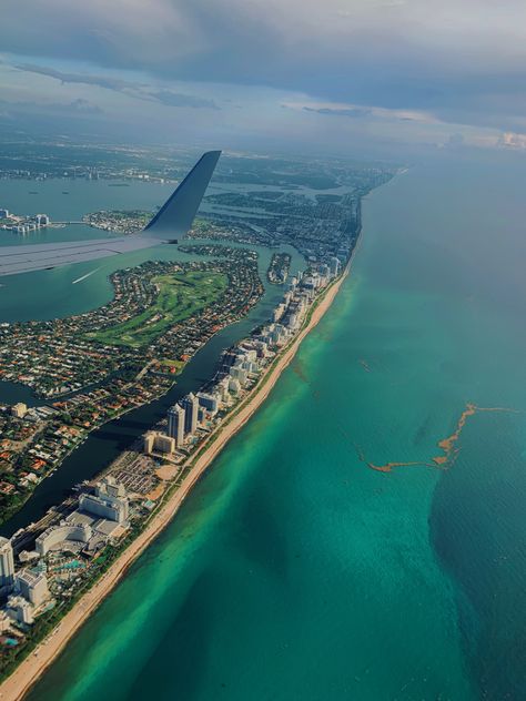 This photo shows the sky view from a plane of Miami Beach, Florida. There are many buidibgs, the beach, and then the sea Plane Window View, Miami South Beach, Plane View, Airplane Window View, Miami Airport, Miami Travel, Miami Life, Florida Trip, Miami Beach Florida