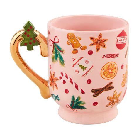 The Pink Gingerbread Pedestal Mug is a beautifully crafted ceramic mug that is perfect for enjoying your favorite hot beverages. With its unique pedestal design, this mug stands out from the rest. The hand-painted handle adds a touch of elegance, while the interior is also hand-painted, making each mug truly one-of-a-kind. Made from high-quality dolomite, this mug is durable and built to last. With a capacity of 13 oz, it can hold a generous amount of your favorite drink. Whether you're sipping on coffee, tea, or hot chocolate, this mug is sure to enhance your drinking experience. Treat yourself or gift it to a loved one, this Pink Gingerbread Pedestal Mug is a must-have addition to any kitchen or mug collection. | Mud Pie Pink Gingerbread Pedestal Mug | Dolomite Pink Gingerbread, Tin Ornaments, Pitcher Set, Holiday Drinks, Hot Beverages, Mud Pie, Bottle Stoppers, Christmas Morning, Sympathy Gifts