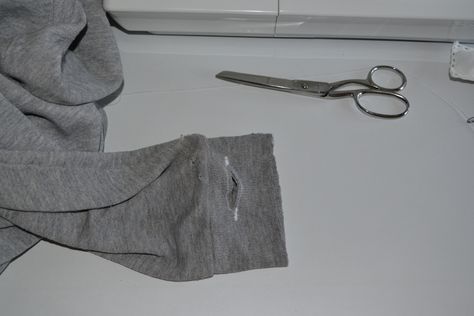 I wanted to create thumb holes in my sweater sleeves, and this is how I did it. #designlifehacks #fashion #sustainable #DIY #create #wardrobe #closet #creative #design #hack #lifehack #designhack #sweater #hole #run #running #cuff #hoodie #thumb #sew #sewing #sewingmachine #solution #workout #sweat #sleeve #measure Sew By Hand, Cuffs Diy, Sustainable Diy, Hand Stitching Techniques, Child Hand, Workout Sweat, Hoodie Diy, Blue Jeans Crafts, Simple Sweaters