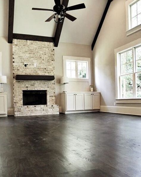 Dark floors + light walls, our favorite combo.  The trim and cabinets are @sherwinwilliams 'Shoji White' (SW#7042)  The floors are 5" Wide Red Oak site finished solid wood - Minwax stain in color, 'Jacobean'. The walls are @benjaminmoore 'Revere Pewter' (HC#172)  #ThreeLittleDogsFlooringAndInteriors #darkwood #hardwoodfloors #fireplace #shojiwhite #wallpainting #redoak #flooring #atlantahomes #beautifulhomes #interiordesign #atlantainteriors #cummingga Dark Walls Light Floors, Dark Trim Light Walls, Dark Floors Light Walls, Living Room Dark Wood, Dark Beams, Tile Effect Laminate Flooring, Minimal Farmhouse, Small Basement Remodeling, Light Walls