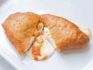 Fresh Tomato and Mozzarella Panzerotti | SAVEUR Panzerotti Recipe, Summer Tomato Recipe, Hot Pocket Recipes, Tomato And Mozzarella, Pizza Fritta, Fresh Tomato Recipes, Summer Tomato, Tomato Recipes, Fresh Mozzarella