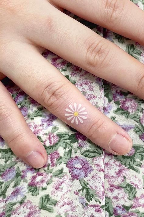 Daisy Finger Tattoo, Daisy Tattoo Ideas, Inner Ear Tattoo, Daisy Tattoo Designs, Toe Tattoos, Daisy Tattoo, Most Popular Flowers, Theme Tattoo, Inner Ear