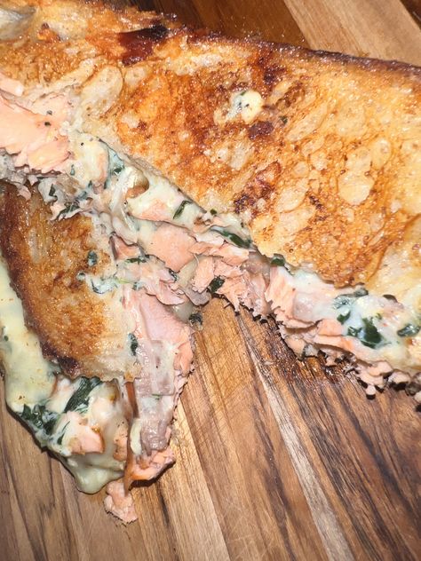 This cheesy Jerk Salmon Melt sandwich is a twist on a classic grilled cheese sandwich. With a crisp, buttery exterior and gooey cheese center. You might think it’s a waste of a premium seafood product like Salmon, but taste makes this recipe worth doing. Grilled Cheese Salmon Sandwich, Salmon Panini Sandwiches, Salmon Melt Sandwich, Salmon Melt Recipe, Salmon Cheesesteak, Salmon Grilled Cheese, Salmon Melt, Pomegranate Desserts, Salmon Sandwich Recipes