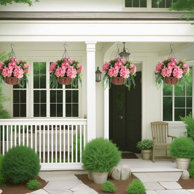 Outdoor artificial hanging plants are perfect for adding a spring feel to your home decor. These fake hanging plants look stylish and realistic and are perfect for use year-round on your patio, balcony, garden or indoor or outdoor spaces. Flower Color: Pink | Primrue 20 Plant Plastic in Green | 20 H x 12 W x 12 D in | Wayfair | Home Decor Hanging Plants Outdoor, Fake Hanging Plants, Summer Porch Decor, Artificial Hanging Plants, Hanging Flower Baskets, Hanging Flower Pots, Green Hydrangea, Flower Pots Outdoor, Patio Balcony