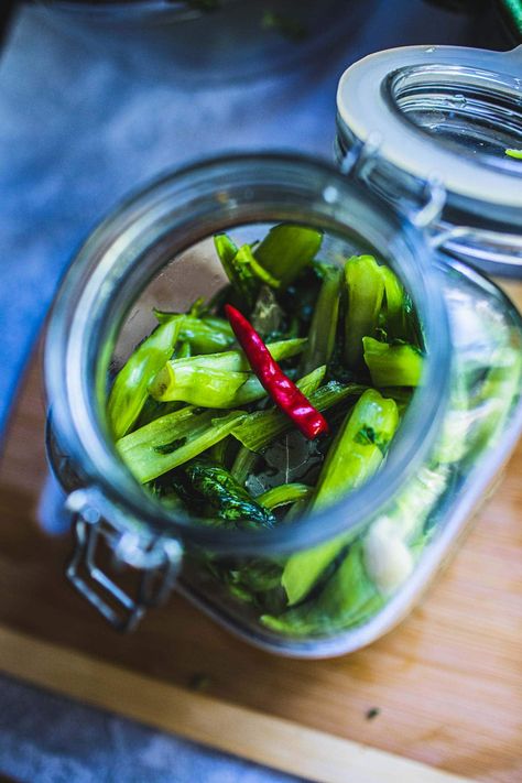 Thai pickled mustard greens (Pak Gad Dong) is a delicious pickle vegetable used in many Thai dishes as a tasty side dish to boost flavors. If you love the strong taste of pickles, olives, capers, or any tasty pickled vegetables, you’ll love this recipe! #thaipickledmustardgreens #pickledmustardgreens #pakgaddong Pickled Mustard Greens, Fermenting Weights, Nut Milk Bag, Pickled Vegetables, Thai Dishes, Mustard Greens, Pickle Jars, Glass Jars With Lids, Garden Recipes