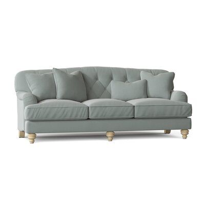 This sofa with the graceful curves along the top rail, the classic Charles of London's arm and tufted back work in harmony to create a welcoming, casual look that invites you to settle in for a while. The exquisitely turned legs, and 3 accent pillows, this piece also incorporates down blend seat cushions for amazing comfort and durability. Body Fabric: Peyton 21 Dove Performance Twill, Leg Color: Manhattan, Arm Covers: No Paula Deen Home Kendall 90" Charles of London Sofa - Sofas in Brown/Manhat London Sofa, Sofa Review, Living Room Furniture Sofas, Velvet Sofa, Birch Lane, Upholstered Sofa, Floor And Wall Tile, Room Sofa, Birch Wood