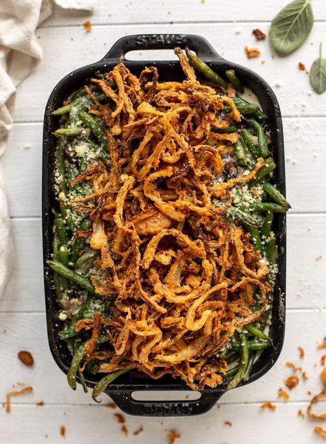 This green bean casserole from scratch is super delicious and topped with french fried onions! It's comforting and wildly flavorful. French Fried Onion Recipes, Fried Onions Recipe, Cheesy Green Bean Casserole, Healthy Green Beans, Best Green Bean Casserole, Green Bean Casserole Recipe, Classic Green Bean Casserole, Easy Green Beans, Best Thanksgiving Side Dishes