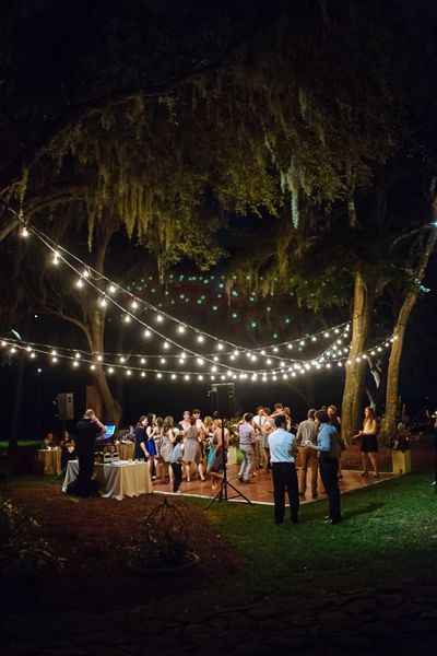 Wedding dance floor ideas that will make your heart sing. String lights at an outdoor reception at RiverOaks in Charleston. Photo: Clay Austin. Caravan Vintage, Outdoor Dance Floors, Backyard Tent, Backyard Wedding Lighting, Lighted Centerpieces, Dance Floor Wedding, Enchanted Forest Wedding, Epic Wedding, Dance Floors