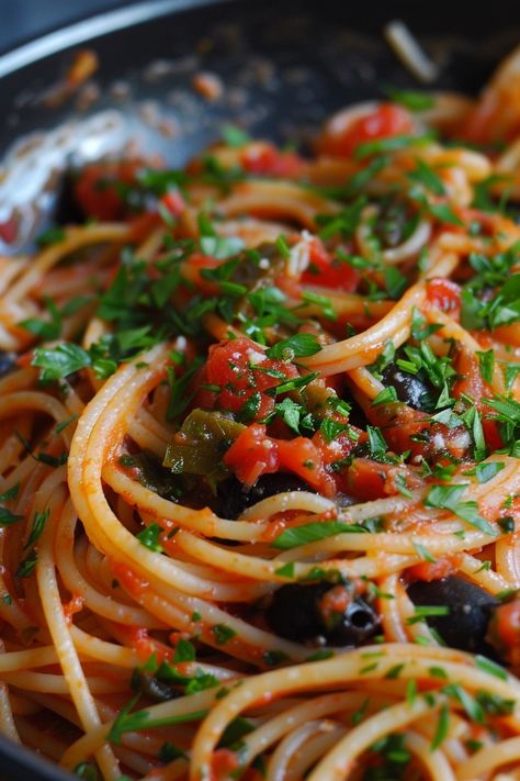 Indulge in the bold flavors of this classic pasta puttanesca recipe that will transport your taste buds straight to Italy. This quick and easy dish is perfect for a weeknight dinner or whenever you crave a comforting meal. The robust combination of tomatoes, olives, capers, and anchovies creates a delightful sauce that pairs perfectly with spaghetti or any pasta of your choice. Elevate your culinary skills with this delicious recipe that is sure to become a family favorite in no time. Spaghetti With Anchovies, Pasta Puttanesca Recipe Authentic, Anchovies Pasta, Pasta Putanesca, Puttanesca Pasta, Pasta Puttanesca Recipe, Puttanesca Recipe, Authentic Pasta, Anchovy Pasta