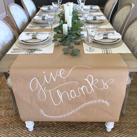 Thanksgiving easy table setting. Kraft paper runner.  Magnolia home placemats. Fresh eucalyptus and candles Thanksgiving Craft Paper Table Runner, Butcher Paper Food Display, Silver Thanksgiving Table Decor, Friendsgiving Table Setting Disposable, Mexican Thanksgiving Decor, Diy Friendsgiving Decor, Thanks Giving Dinner Table Decor, Cricut Thanksgiving Projects For Table, Easy Thanksgiving Place Settings