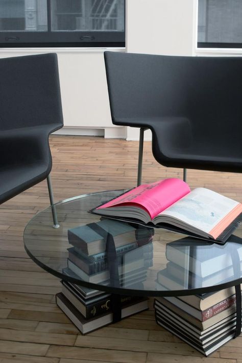 glass coffee table supported by stacked books and strapped books, Magdalena Keck Diy Coffee Table Glass Top, Home Office Coffee Table, Bookshelf Coffee Table, Diy Glass Top Coffee Table, Diy Glass Coffee Table, Glass Coffee Table Diy, Diy Glass Table, Coffee Table Books Diy, Creative Coffee Table Ideas