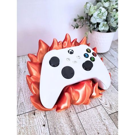 Flame Game Controller Holder, Game Controller Stand, Gaming Décor, Variety of Colors, Xbox, PS5 🔥 Are you ready to take your gaming setup to the next level? Our 3D Printed Flame-Inspired Game Controller Holder is here to set your space on fire with its stunning design and functionality! Features: 🌟 Epic Flame Design: Crafted with a unique flame-inspired design, this holder is not just a practical accessory but a striking piece of art. Perfect for any gamer who wants to make a statement. 🎮... Xbox Controller Holder, Flame Game, Game Controller Holder, Controller Stand, Controller Holder, Xbox Controller, Game Controllers, Video Game Controller, Flame Design