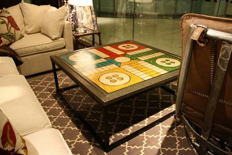 Ludo coffee table. #andrewmartin #interiordesign #decor #board #game #coffeetable #buttons #table Boardgame Cafe Interior, Cafe Games Ideas, Cafe Plan Architecture, Japanese Living Room Design, Lego Display Ideas, Tall Coffee Table, Board Game Themes, Carrom Board, Games Room Inspiration