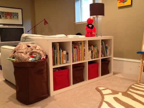 Not sure the room is big enough to split up this way - like the idea, though Rec Room Basement, Diy Hidden Storage Ideas, Creative Toy Storage, Living Room Toy Storage, Family Friendly Living Room, Play Corner, Basement Playroom, Behind Couch, Basement Reno