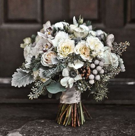 This winter wedding bridal bouquet features a beautiful mix of white flowers, frosted greenery, berries and pine cones - a perfect, natural take on the winter season in a wedding bouquet.  #winterwedding #winterweddingflowers #winterweddingideas #winterweddingdecor #bridalbouquet #bridalbouquetideas #weddingflowers #bridalflowers #floraldesign #winterflowers #bouquetideas #bridalbouquetideas Whimsical Wedding Bouquet, Vendela Roses, Silver Winter Wedding, Winter Bridal Bouquets, Boda Diy, Winter Wedding Bouquet, Flowers And Greenery, Winter Bouquet, Winter Wedding Flowers