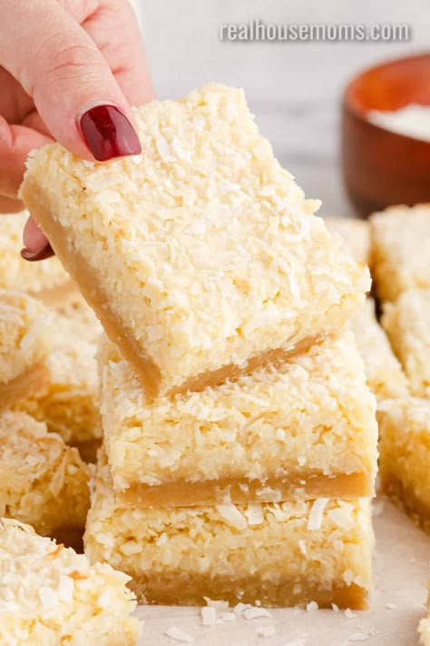 Buttery Coconut Bars are a sinfully good dessert with a sweet buttery crust and a coconut topping that will make everyone a coconut lover! #Realhousemoms #buttery #coconutbars #sweet #dessert #coconut #vanilla #shortbread #easterdessert #potluckdessert Buttery Coconut Bars, Coconut Dessert Bars, Dessert Coconut, Bars Recipes Healthy, Cookies With Coconut, Coconut Recipes Dessert, Vanilla Shortbread, Sweet Bars, Coconut Tart