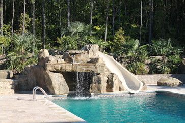 Rico Rock grotto, waterfall and slide into pool tropical-pool Pool Rock Slide, Slide Into Pool, Grotto Waterfall, Pool Grotto, Pool Tropical, Swimming Pool Waterfall, Stone Water Features, Rock Waterfall, Stone Pool