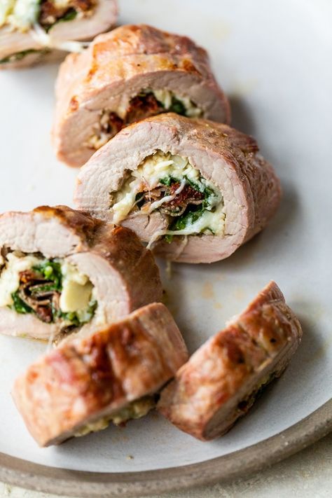 Pork tenderloin is perfect for the holidays, and it's just as lean as chicken breast. I love how the colors of the spinach and sundried tomatoes look so festive when you cut it open. Skinnytaste Pork Tenderloin, Pork Tenderloin Stuffed, Cool Diet Recipes, Prosciutto And Mozzarella, Loin Recipes, Mustard Pork Tenderloin, Mediterranean Foods, Weekly Dinner, Stuffed Pork