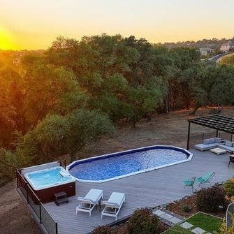 Oval Pool Deck Ideas Above Ground, Above Ground Pool Surround Ideas, Above Ground Pool With Deck Off House, Above Ground Swimming Pool Deck, Above Ground Pool Deck, Oval Pool, Pool Deck Ideas, Swimming Pool Decks, Sloped Yard