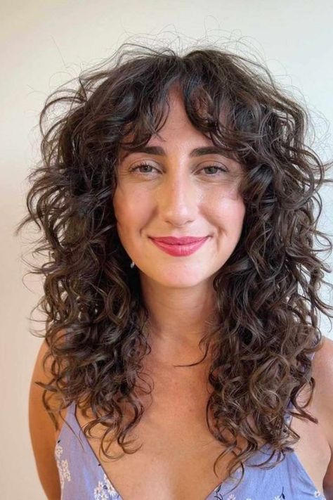 Guide to Curtain Bangs for Women with Curly Hair - Wittyduck Long Shag Cut For Curly Hair, Bangs On Wavy Curly Hair, Curly Haircut 2023, Curly Wolf Cut No Bangs, 2c Shag Haircut, Mid Curly Haircuts, 70s Shag Curly Hair, Curly Shag Curtain Bangs, Shaggy Curly Hair Mid Length